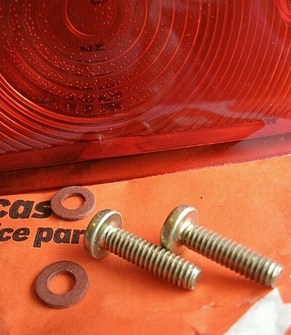 One New Old Stock Red Bedford TK Rear Light Lens Lucas Butlers With Fitting Kit.