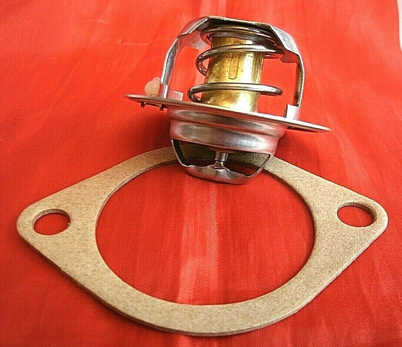 One New Triumph 3 Litre V8 Stag 82% Thermostat & Improved Quilty 1/16" Gasket.