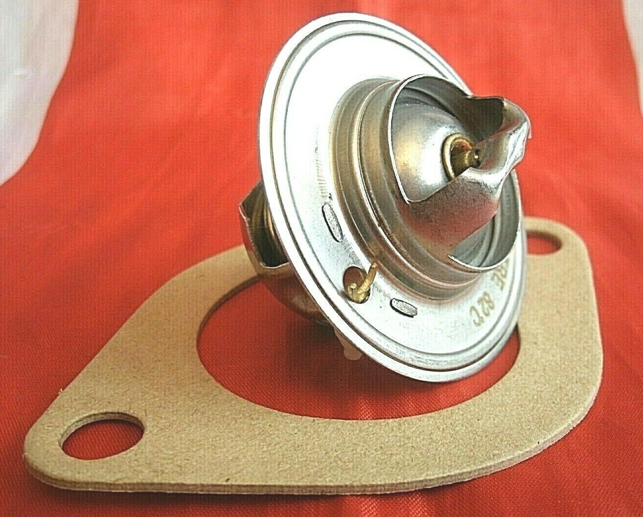 One New Triumph 3 Litre V8 Stag 82% Thermostat & Improved Quilty 1/16" Gasket.