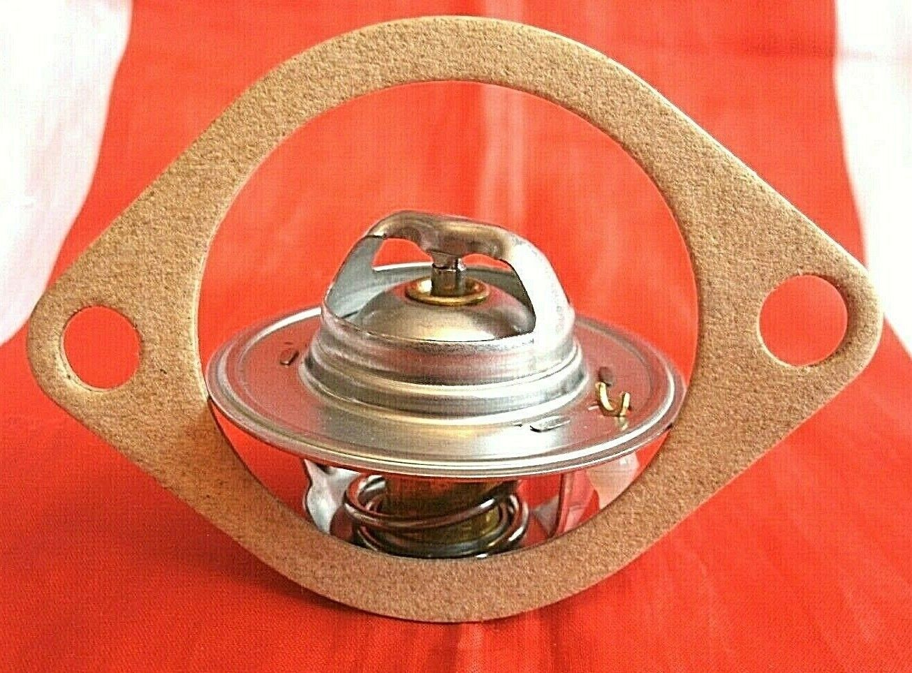 One New Triumph 3 Litre V8 Stag 82% Thermostat & Improved Quilty 1/16" Gasket.