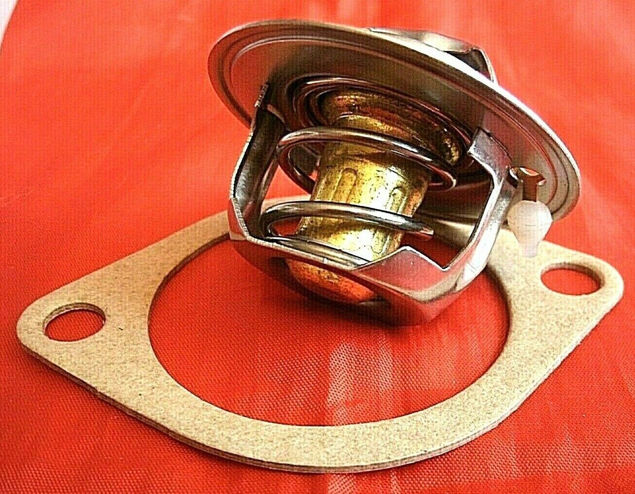 One New Triumph 3 Litre V8 Stag 82% Thermostat & Improved Quilty 1/16" Gasket.